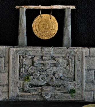 Detail shot of the gong atop the wall along with an Aztec glyph that seemed to fit the scene. I made the gong, glyph and the gong columns on my 3D printer. Click for a larger image.