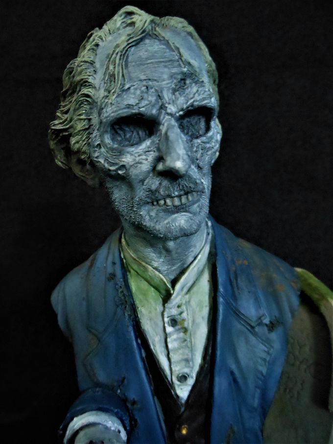 Closeup of the vengeful spirit. You can actually make out Peter Cushing (Grimsdyke) under all that makeup.